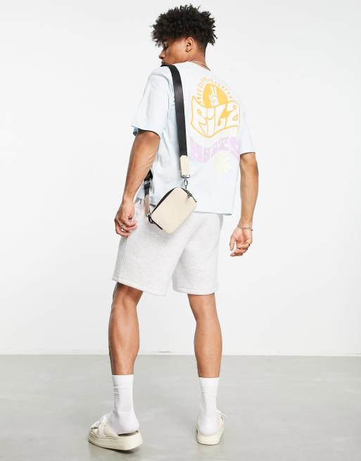 Camiseta azul extragrande con estampado en la espalda exclusiva en ASOS de Fila