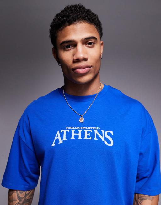 Camiseta azul extragrande con estampado gráfico de ciudad en el pecho de ASOS DESIGN, 2 de 4