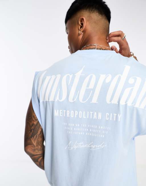 Camiseta azul extragrande sin mangas con estampado de Ámsterdam en la espalda de ASOS DESIGN