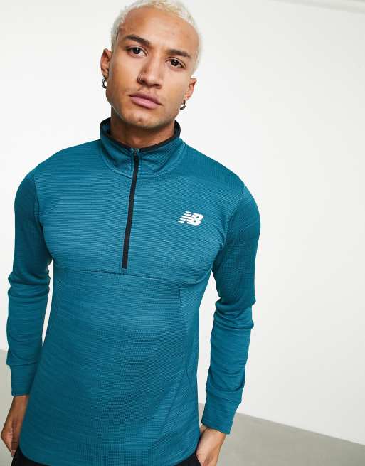 Camiseta azul marino con cremallera corta de New Balance, 3 de 4
