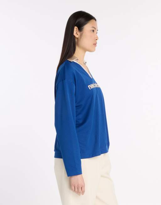 Camiseta azul oscuro de manga larga de malla de punto liso de New Balance, 4 de 4