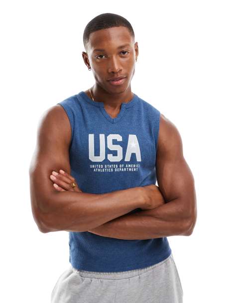 Camiseta azul sin mangas ajustada con muesca en el cuello y estampado "USA" en el pecho de ASOS DESIGN - view 1