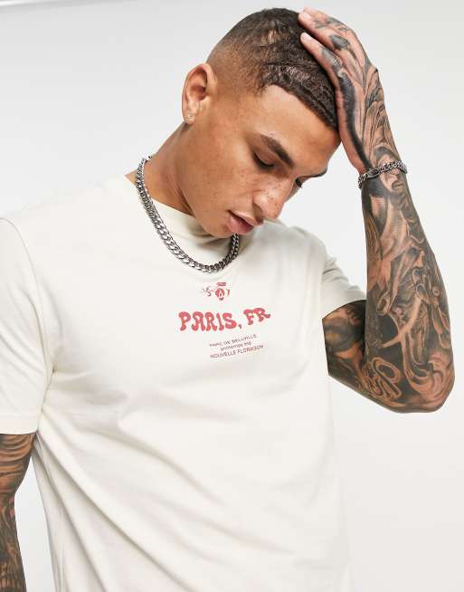 Camiseta beis con estampado de ciudad en la parte delantera de ASOS DESIGN