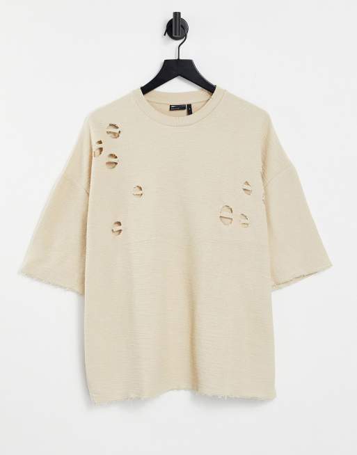 Camiseta beis extragrande con diseño desgarrado de ASOS DESIGN