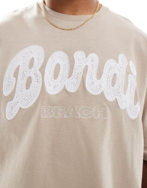 Camiseta beis lavado de corte cuadrado extragrande con bordado de ciudad de ASOS DESIGN, 2 de 4