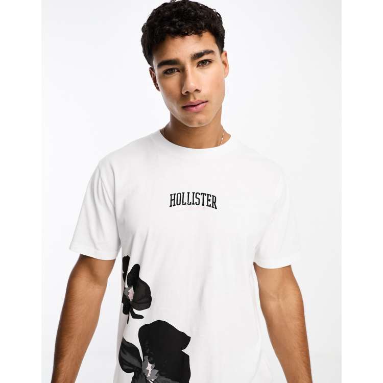 Camiseta blanca con estampado floral y logo en el centro de Hollister Cra wallonieShops