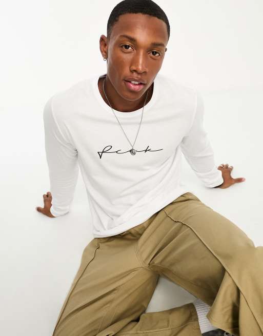 Camiseta blanca de manga larga con logo de garabato de FCUK
