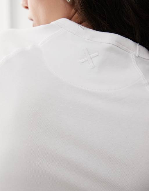 Camiseta blanca entallada con mangas raglán de COLLUSION, 2 de 4