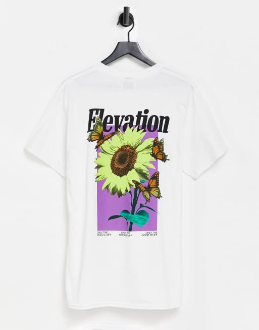 Camiseta blanca extragrande con estampado de flor y texto 