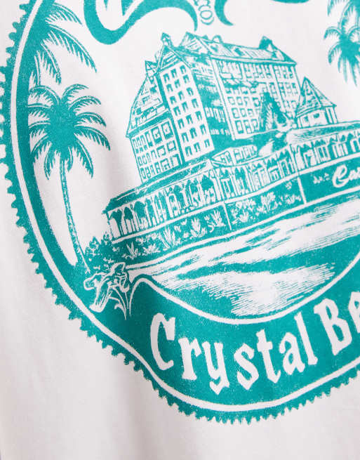Camiseta blanca extragrande sin mangas con gráfico playero de ASOS DESIGN, 3 de 5