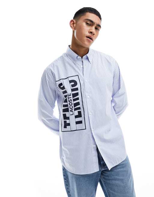 Camiseta blanca y azul de manga larga con logo Heritage de Lacoste