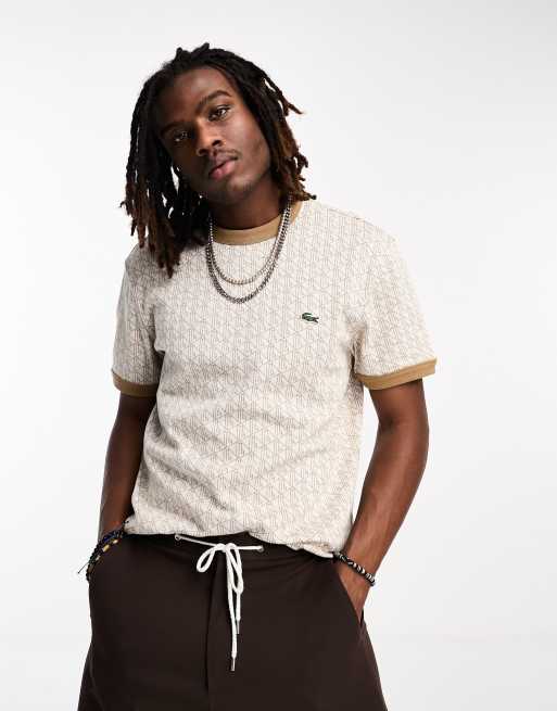 Camiseta blanco hueso con estampado gráfico abstracto y logo de Lacoste