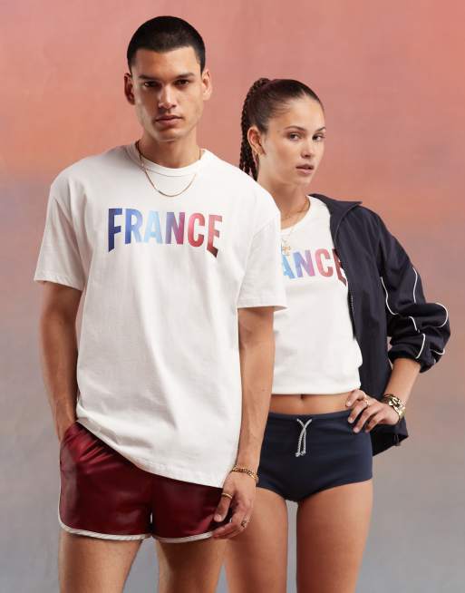 Camiseta blanco malvavisco con diseno del equipo frances para los Juegos Olimpicos de Paris 2024 de Le Coq Sportif ASOS