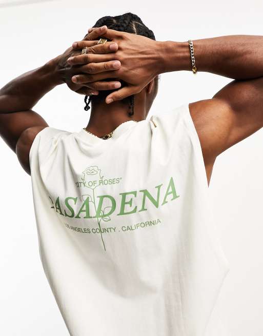 Camiseta color crudo extragrande sin mangas con estampado de rosa y ciudad en la espalda de ASOS DESIGN