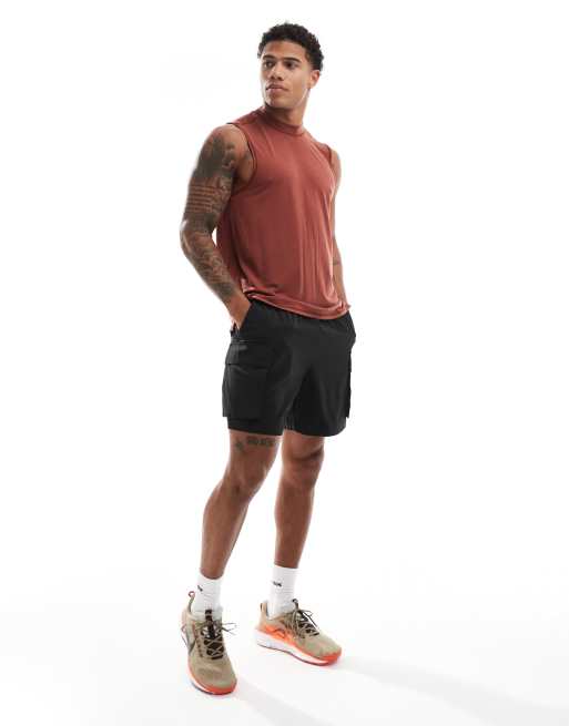 Camiseta deportiva color óxido sin mangas con sisas caídas de tejido suave de secado rápido Icon de 4505 