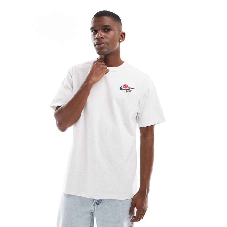 Camiseta gris claro con logo y flor Swoosh de Nike ASOS