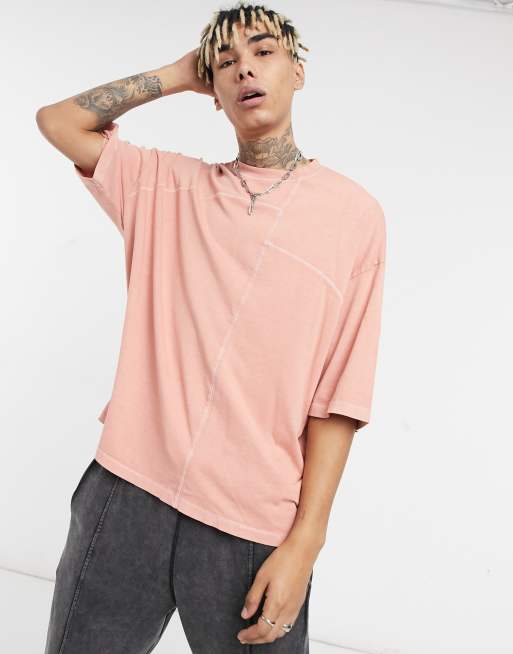 Camiseta larga rosa extragrande con lavado ácido y bajo asimétrico de tejido orgánico de ASOS DESIGN