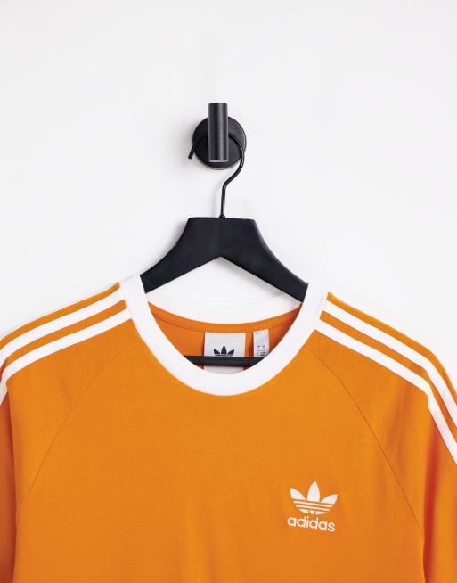 marea cristal yermo Camiseta naranja con diseño de tres rayas adicolor de adidas Originals |  ASOS