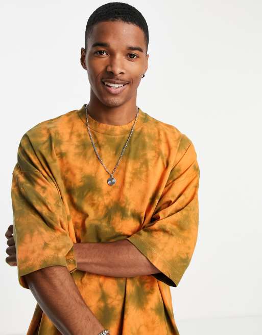 Camiseta naranja extragrande con efecto tie dye de ASOS DESIGN