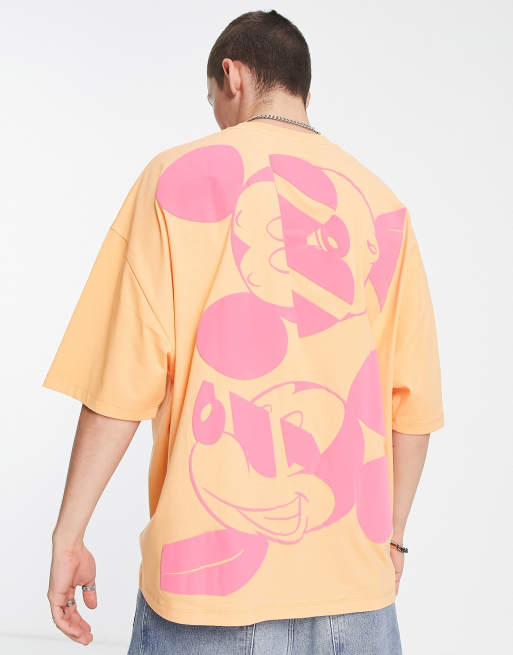 Camiseta naranja extragrande con estampado de Mickey Mouse de ASOS DESIGN