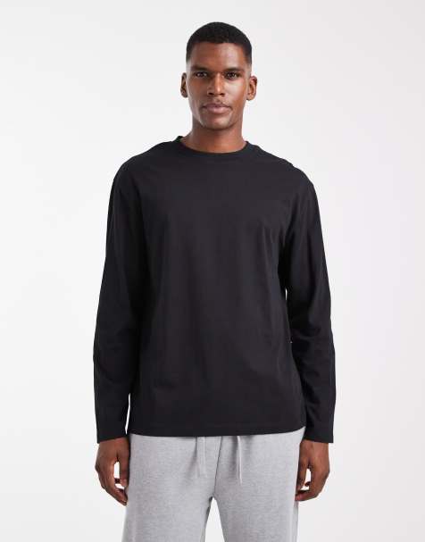 Camiseta negra básica holgada de manga larga con cuello redondo Essentials de ASOS DESIGN - view 1