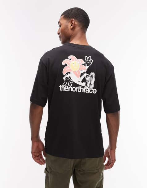 Camiseta negra con estampado de flor en la espalda de The North Face - view 1