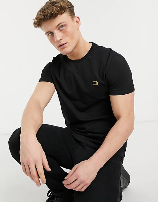 Camiseta negra con logo dorado de Burton Menswear