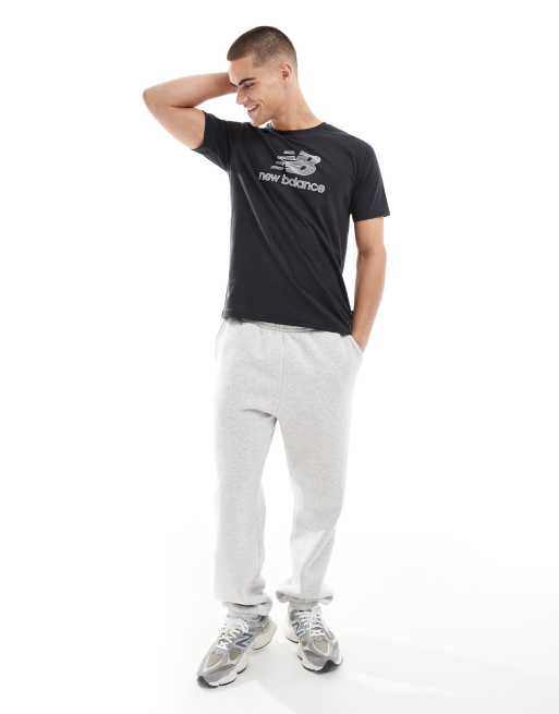 Camiseta negra con logo Heathertech de New Balance, 3 de 4