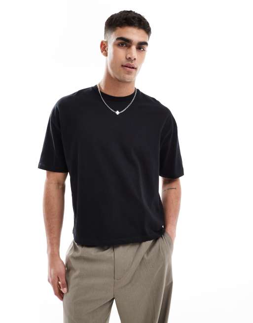Camiseta negra de corte cuadrado extragrande con estampado gráfico floral de ASOS DESIGN, 3 de 4
