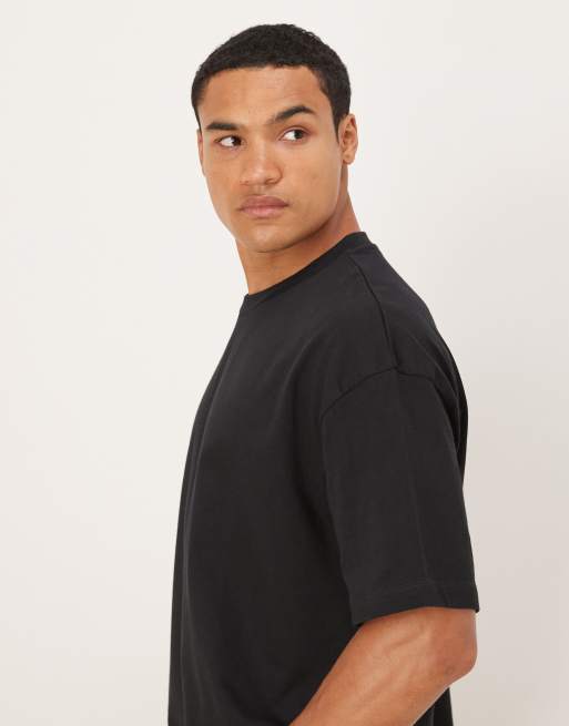 Camiseta negra de corte cuadrado extragrande con estampado gráfico floral de ASOS DESIGN, 4 de 5