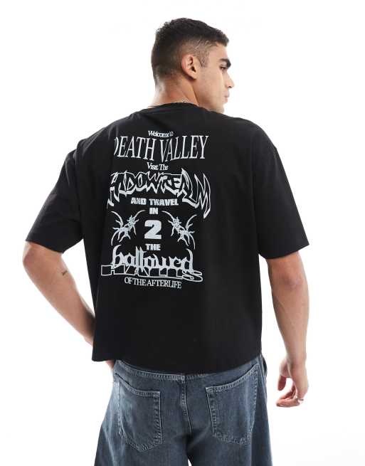 Camiseta negra de corte cuadrado extragrande y manga corta con estampado gráfico de Halloween en la espalda de ASOS DESIGN