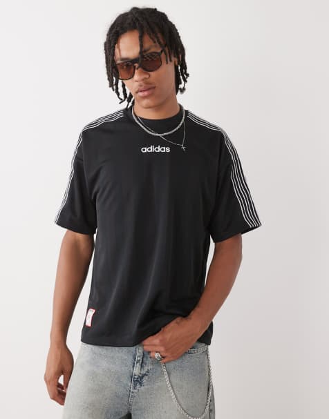 Camiseta negra de estilo años 90 con detalle de rayas de punto liso de adidas Originals - view 1