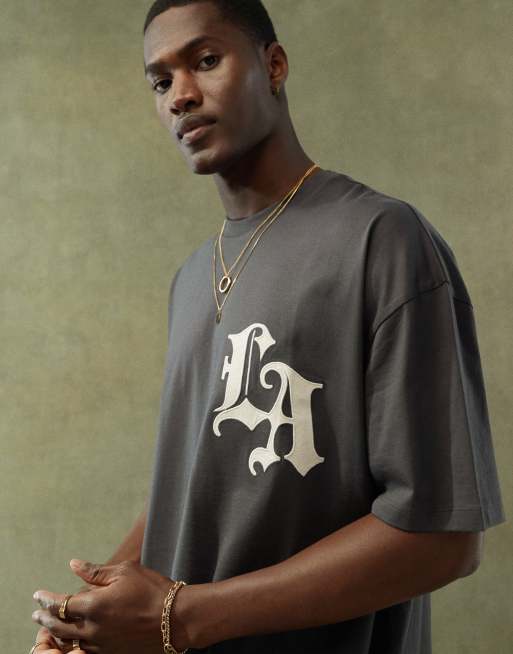 Camiseta negra extragrande con estampado de ciudad en la parte delantera de ASOS DESIGN