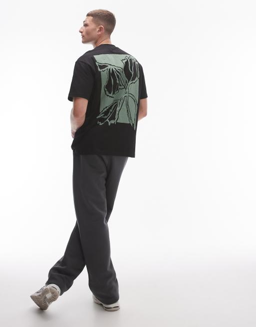 Camiseta negra extragrande con estampado de flor pintada en la parte delantera y trasera de Topman