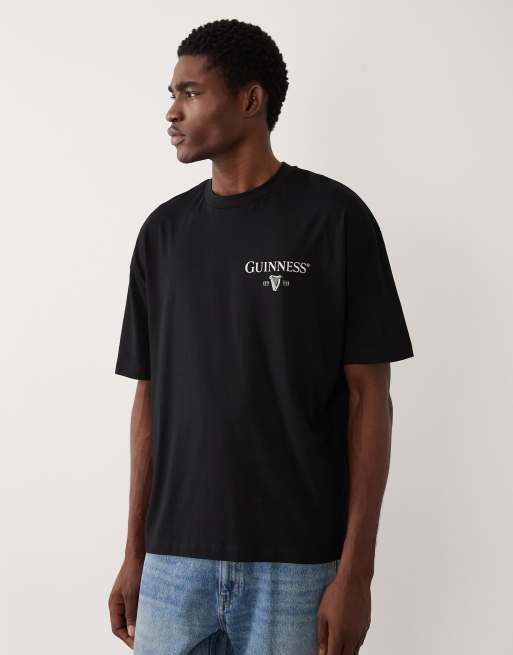 Camiseta negra extragrande con estampado de Guinness de ASOS DESIGN, 3 de 5