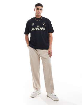 Camiseta negra extragrande con estampado deportivo en el pecho de ASOS DESIGN