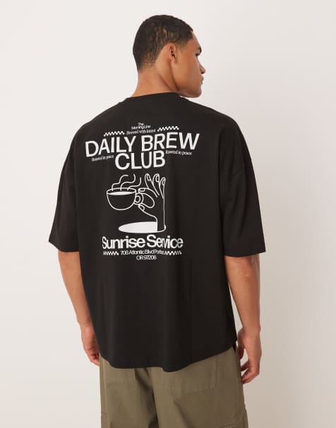 Camiseta negra extragrande con sisas caídas y detalle estampado de ASOS DESIGN - view 1