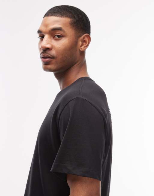 Camiseta negra holgada con estampado trasero Track de The North Face, 4 de 5