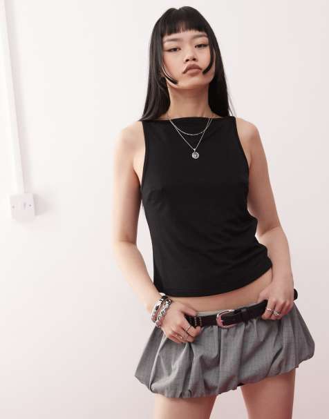 Camiseta negra sin mangas con cuello barco de tejido texturizado de COLLUSION - view 1
