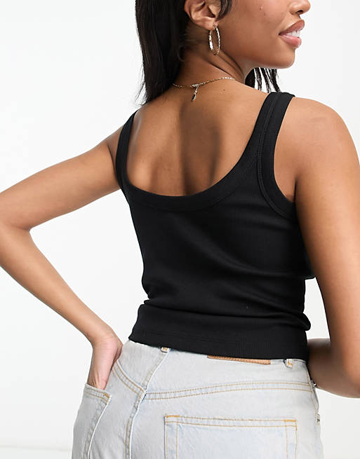Alfombra de pies Norteamérica Salón Camiseta negra sin mangas con escote pronunciado en la espalda de canalé de  ASOS DESIGN Hourglass | ASOS