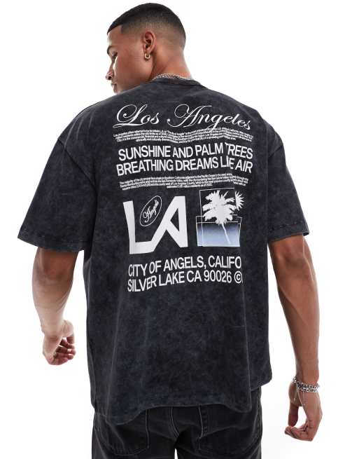 Camiseta negro lavado extragrande con estampado de nombre de ciudad en la espalda de ASOS DESIGN