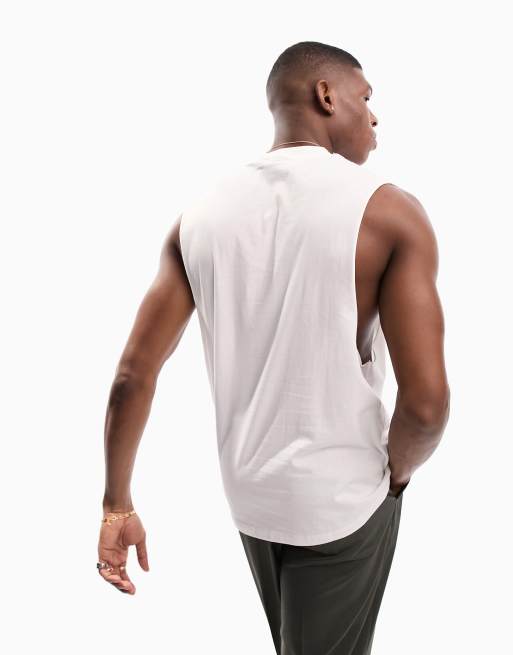 Camiseta relax sin mangas con sisas caídas en blanco de ASOS DESIGN, 2 de 4