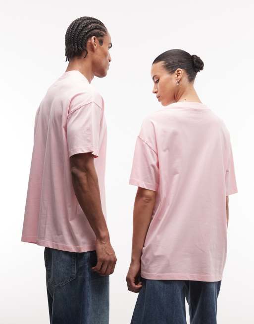 Camiseta rosa con estampado azul y logo "X" de COLLUSION Unisex, 4 de 4