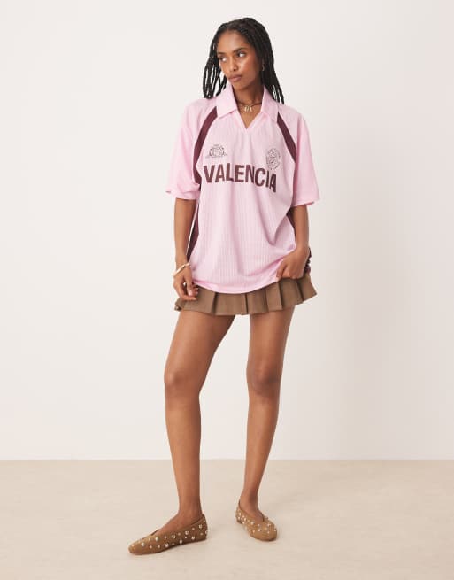 Camiseta rosa extragrande de estilo rugby con estampado gráfico 