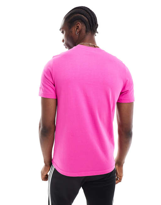 Camiseta rosa fucsia neón con logo gráfico de estilo años 80 de