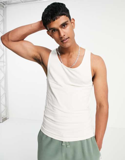 Camiseta sin mangas color crema ajustada de mezcla de algodón de ASOS DESIGN - BEIGE