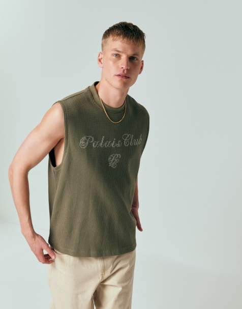 Camiseta verde extragrande sin mangas con estampado gráfico de texto en la espalda de tejido muy grueso de punto gofrado de ASOS DESIGN (parte de un conjunto) - view 1