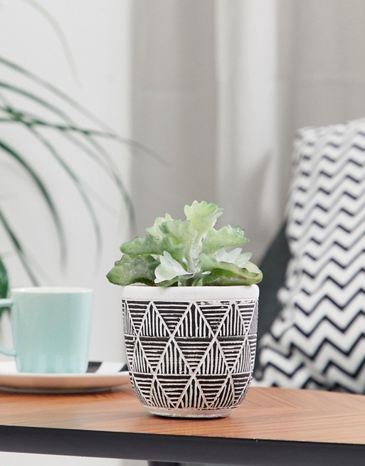 Candlelight patterned faux plant pot