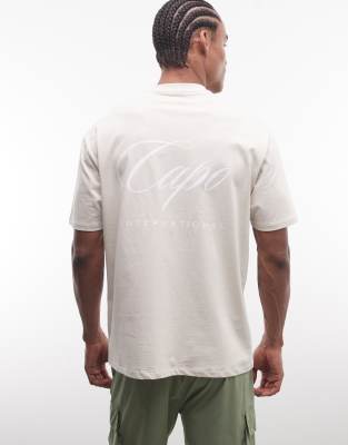 CAPO CAPO international logo back print t-shirt in beige-Neutral