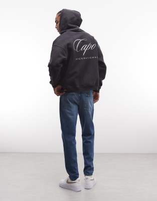 CAPO CAPO international logo zip through hoodie in black